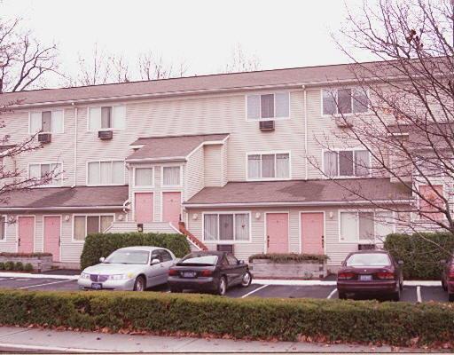 30 Elmcroft Road, Unit A1 Stamford, CT 06902 - Photo 1 of 1 a front view of a house with outdoor space