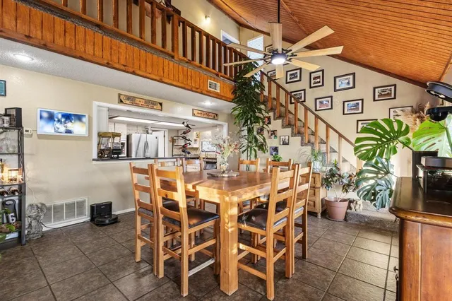 a view of a table and chairs in a patio