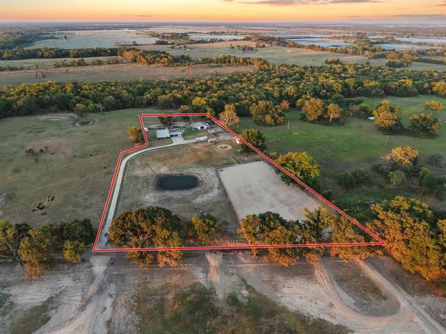 an aerial view of a house with a garden