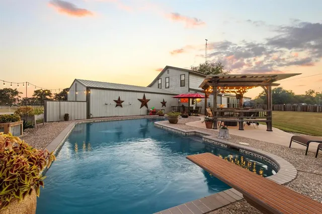 a view of a backyard with sitting area