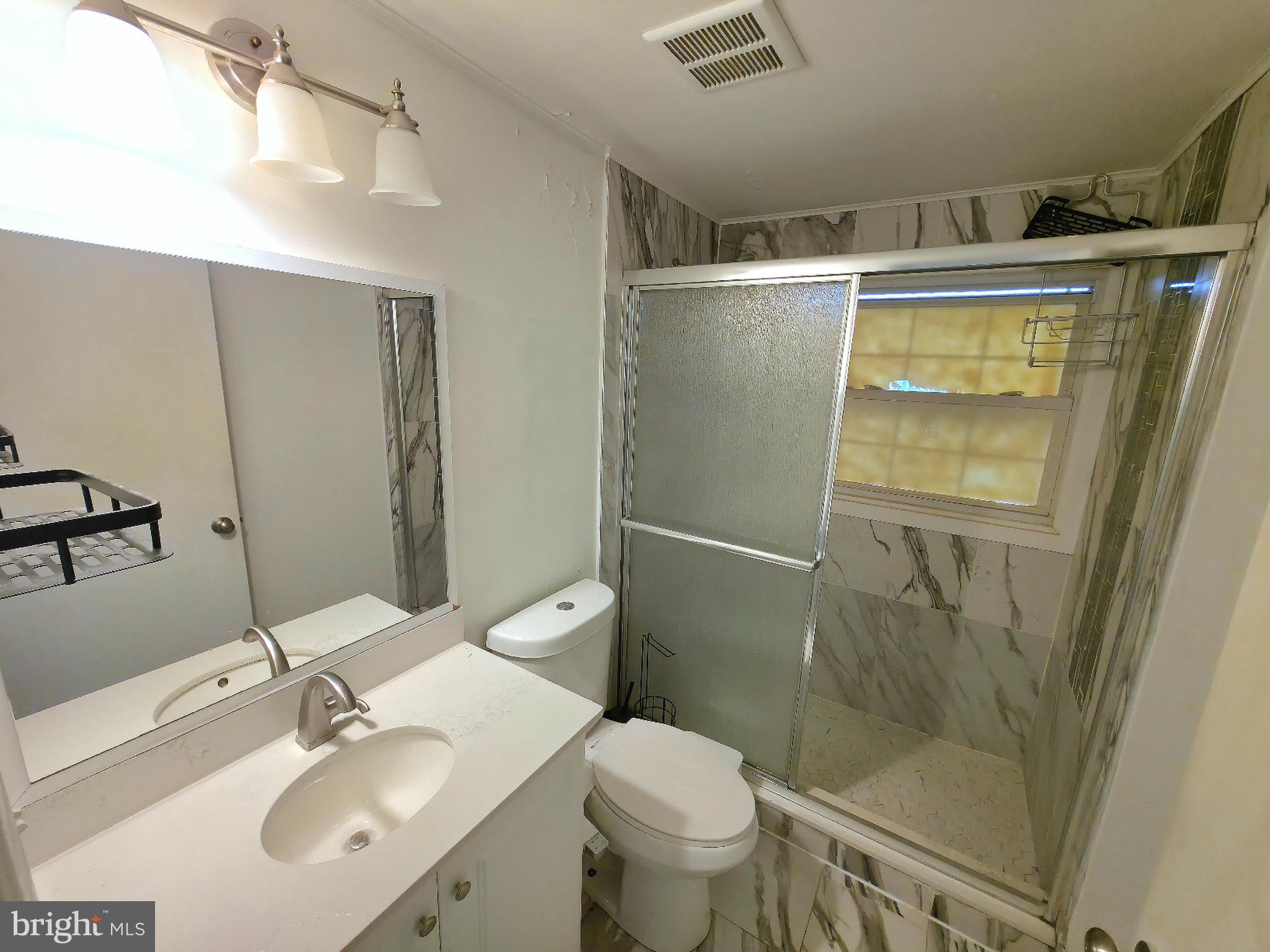 10 Melville Lane Willingboro, NJ 08046 - Photo 17 of 28 a bathroom with a sink toilet and shower