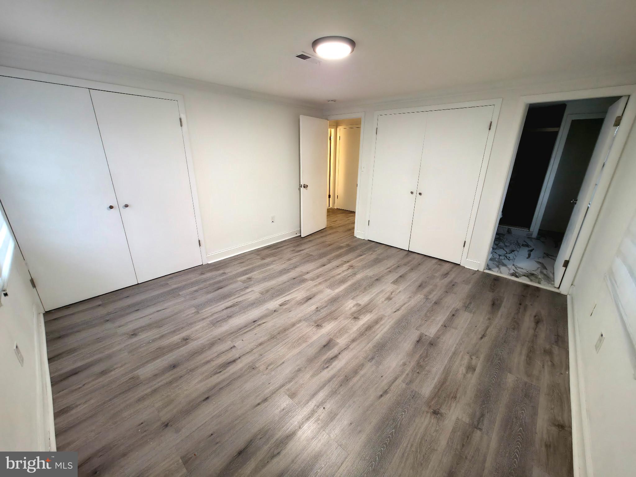 10 Melville Lane Willingboro, NJ 08046 - Photo 24 of 28 a view of an empty room with wooden floor and closet
