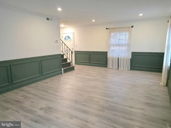 a view of a livingroom with wooden floor