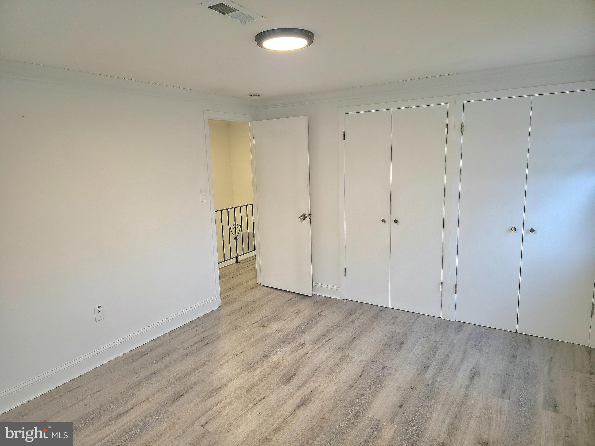 10 Melville Lane Willingboro, NJ 08046 - Photo 8 of 28 a view of an empty room with wooden floor