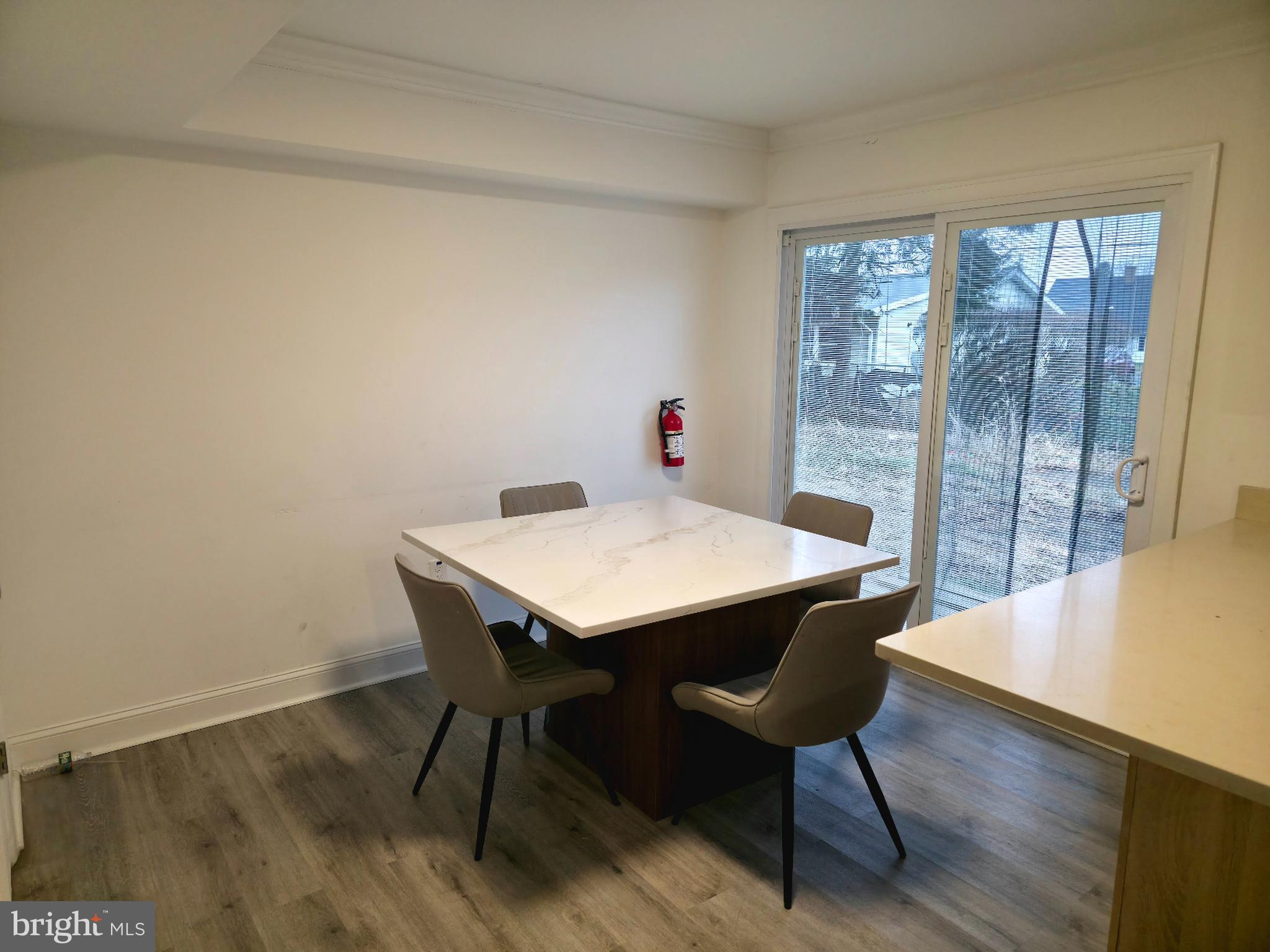 10 Melville Lane Willingboro, NJ 08046 - Photo 10 of 28 a view of a dining room with furniture window and wooden floor