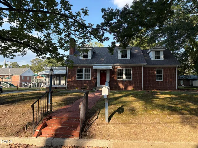 a view of a house with a swimming pool