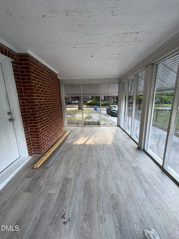 a view of kitchen with furniture and wooden floor