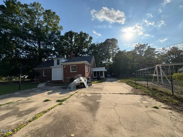 a view of a backyard with a barbeque