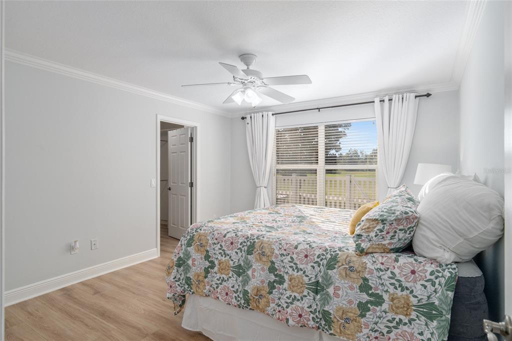 967 Livingston Loop The Villages, FL 32162 - Photo 19 of 62 a bedroom with a large bed and a window