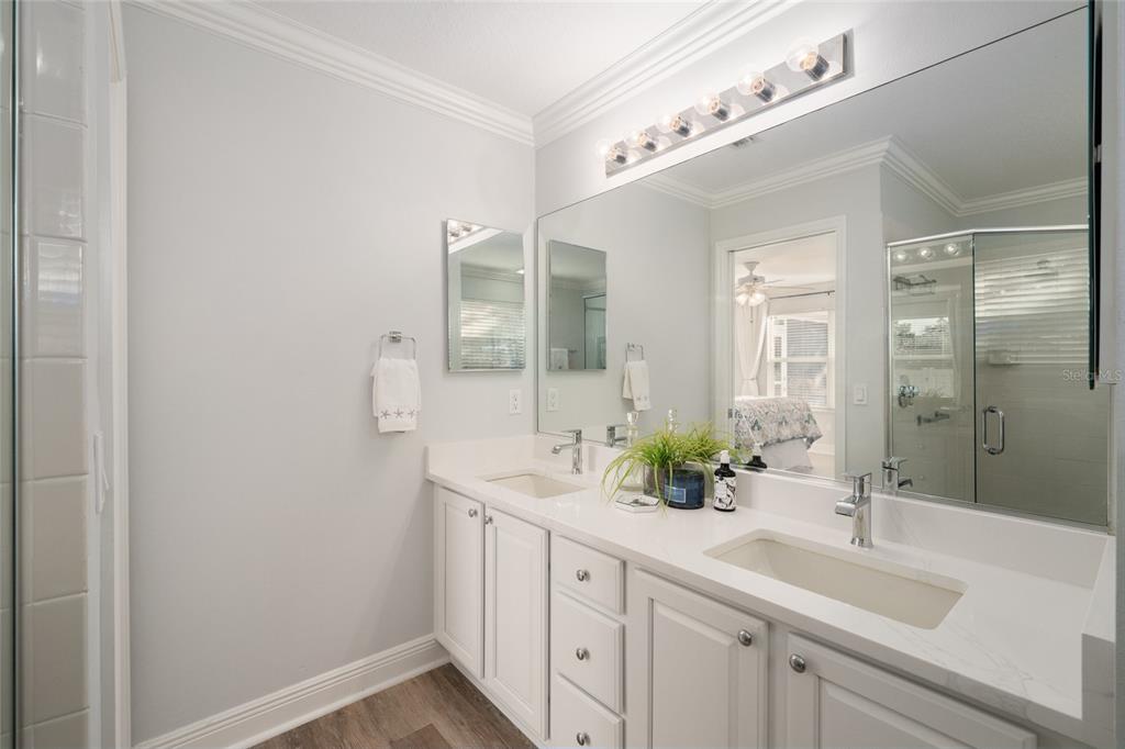 967 Livingston Loop The Villages, FL 32162 - Photo 24 of 62 a bathroom with a sink and a mirror