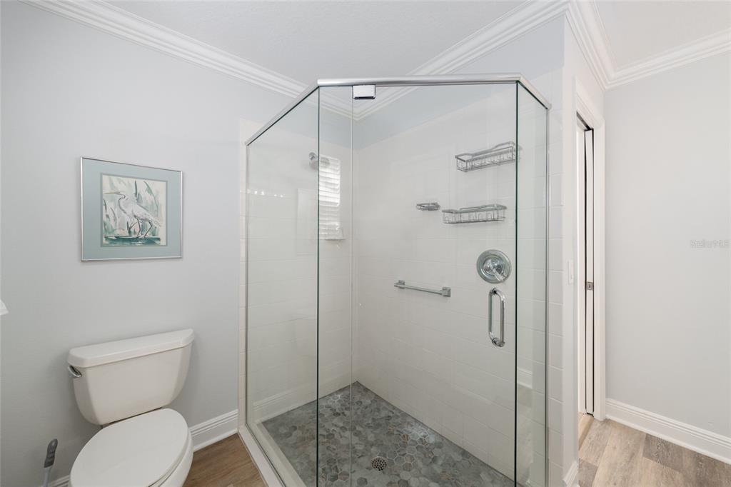 967 Livingston Loop The Villages, FL 32162 - Photo 25 of 62 a bathroom with a shower and a toilet