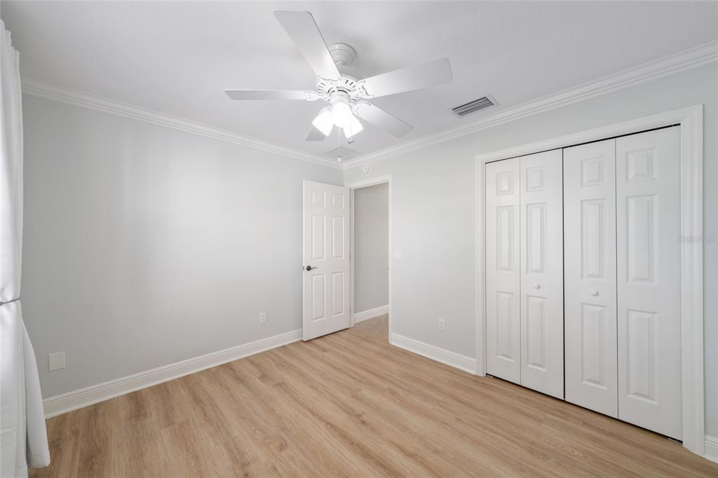 967 Livingston Loop The Villages, FL 32162 - Photo 32 of 62 a view of an empty room with wooden floor