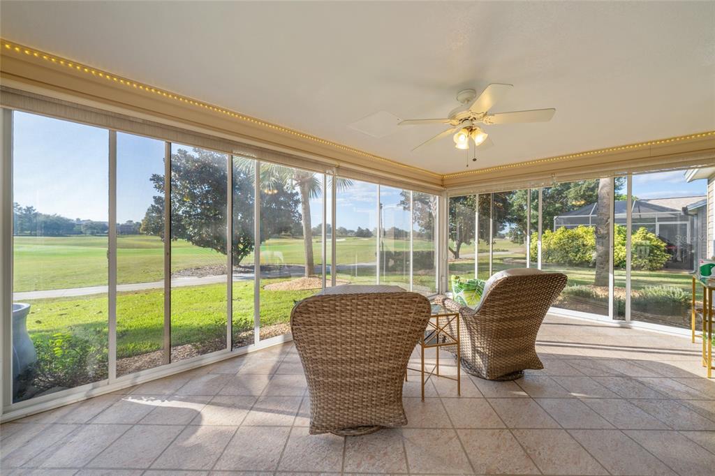 967 Livingston Loop The Villages, FL 32162 - Photo 34 of 62 a view of a dining room with furniture and a garden