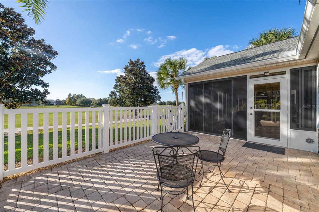 967 Livingston Loop The Villages, FL 32162 - Photo 36 of 62 a view of a chair and tables front of the house