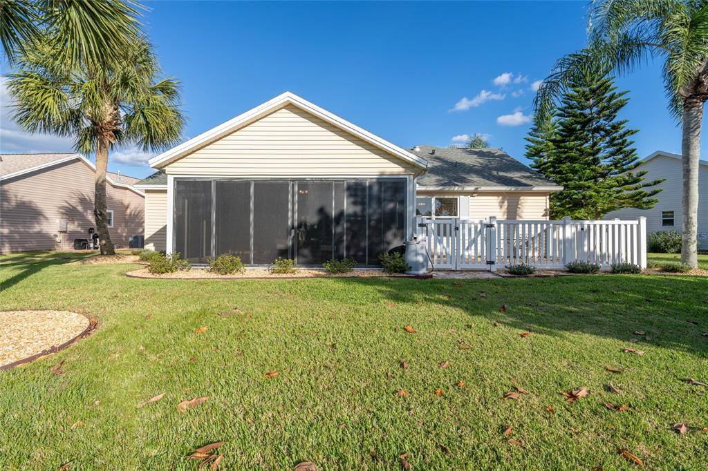 967 Livingston Loop The Villages, FL 32162 - Photo 42 of 62 a view of a house with a yard