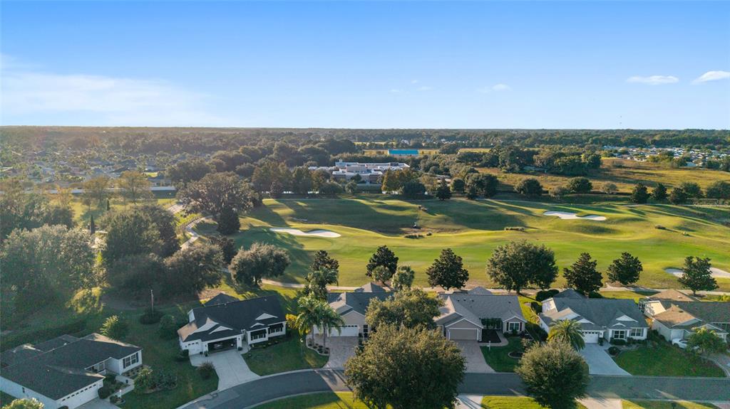 967 Livingston Loop The Villages, FL 32162 - Photo 49 of 62 an aerial view of residential building and lake