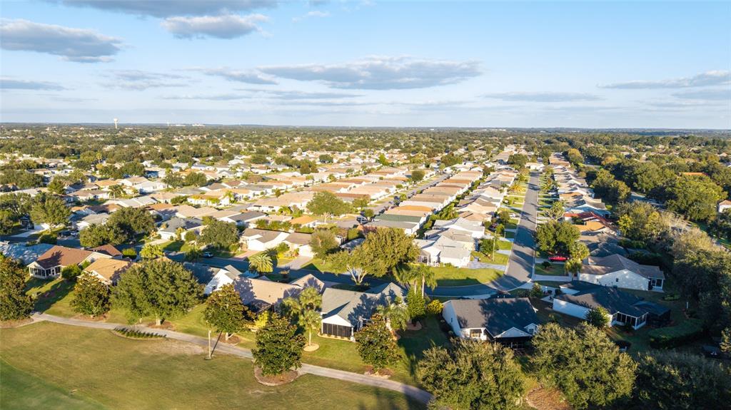 967 Livingston Loop The Villages, FL 32162 - Photo 61 of 62 an aerial view of residential building and lake