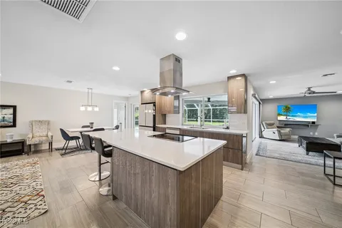 a kitchen with stainless steel appliances a sink and a refrigerator