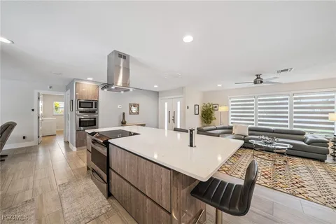 a kitchen with stainless steel appliances a stove a microwave and a refrigerator