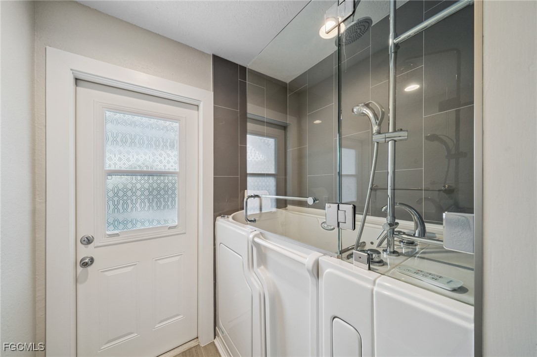 422 Coral Drive Cape Coral, FL 33904 - Photo 23 of 43 a bathroom with double vanity sink and a mirror