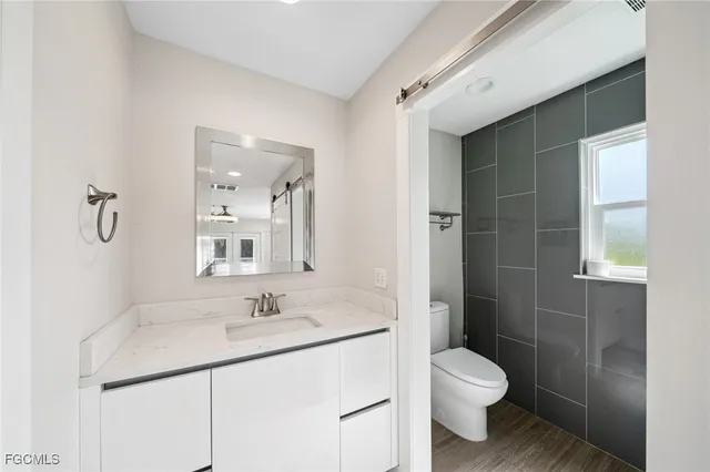 a bathroom with a shower and a sink