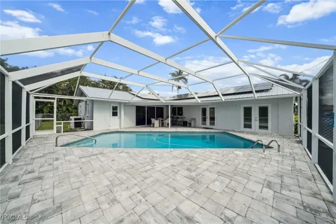a view of swimming pool with seating area