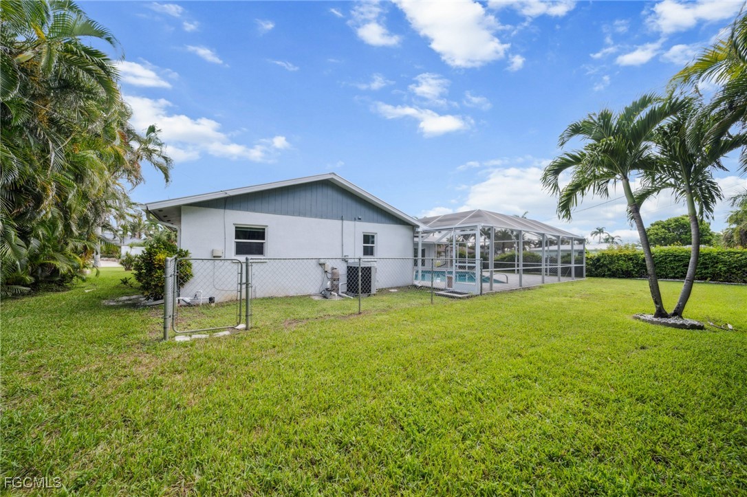 422 Coral Drive Cape Coral, FL 33904 - Photo 36 of 43 a house with garden in front of it