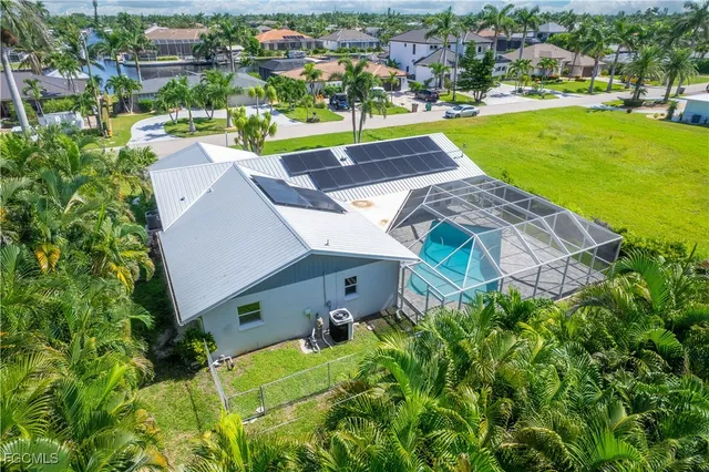 a aerial view of a house with a yard