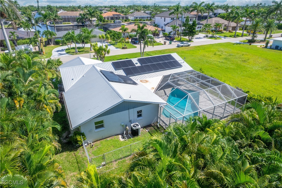 422 Coral Drive Cape Coral, FL 33904 - Photo 37 of 43 an aerial view of a house with a garden and lake view