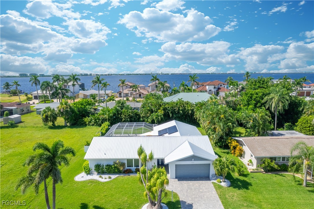 422 Coral Drive Cape Coral, FL 33904 - Photo 39 of 43 an aerial view of a house with a garden