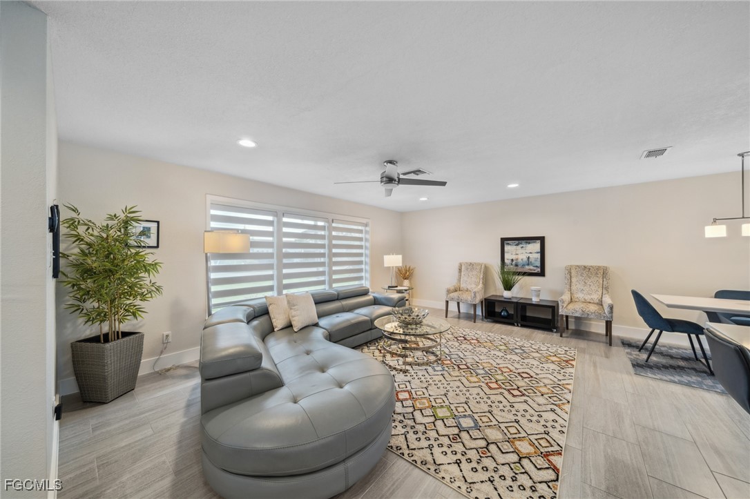 422 Coral Drive Cape Coral, FL 33904 - Photo 5 of 43 a living room with furniture and a couch