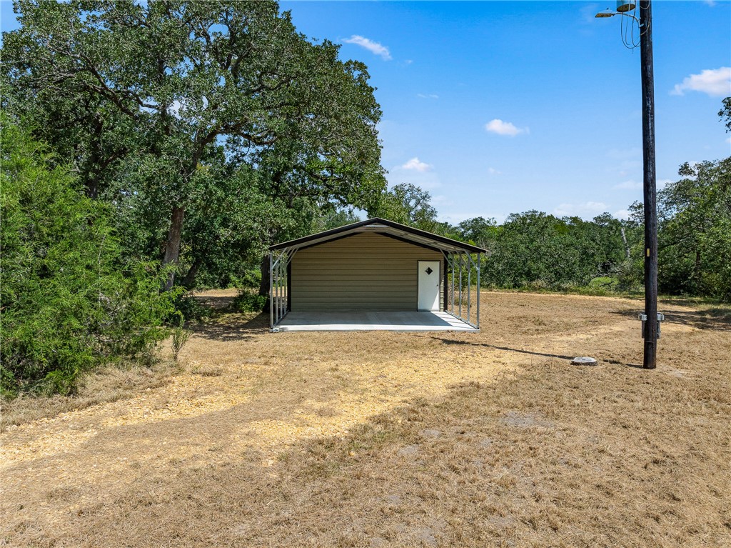 789 Quail Hollow Road Caldwell, TX 77836 - Photo 20 of 27 a view of backyard of a house