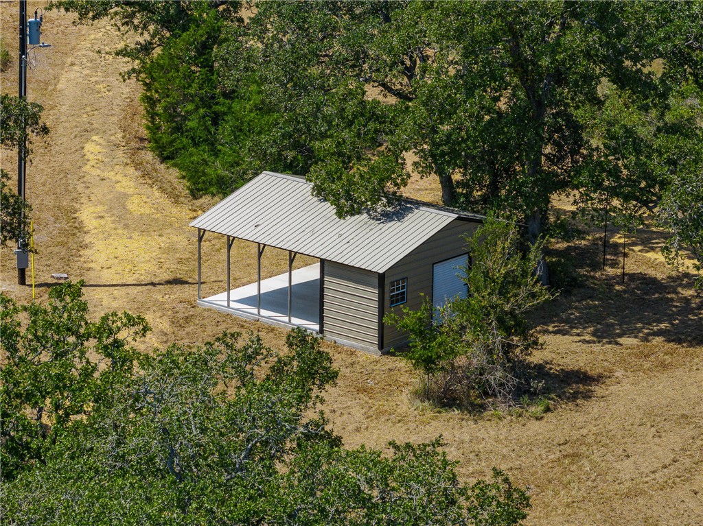789 Quail Hollow Road Caldwell, TX 77836 - Photo 24 of 27 a house view with a backyard space