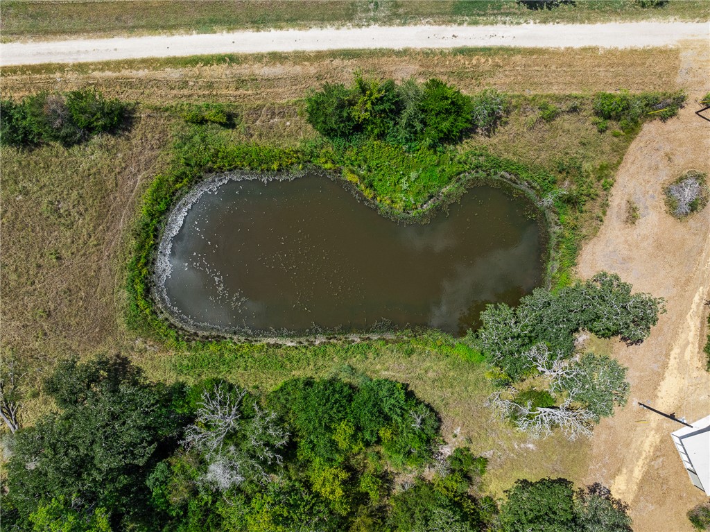 789 Quail Hollow Road Caldwell, TX 77836 - Photo 27 of 27 an aerial view of a house with a yard and lake view