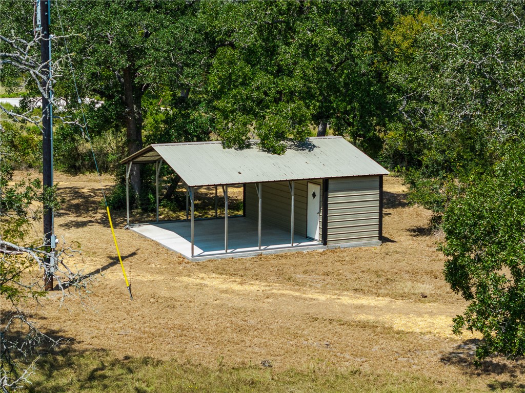 789 Quail Hollow Road Caldwell, TX 77836 - Photo 3 of 27 a view of a house with a yard and sitting area