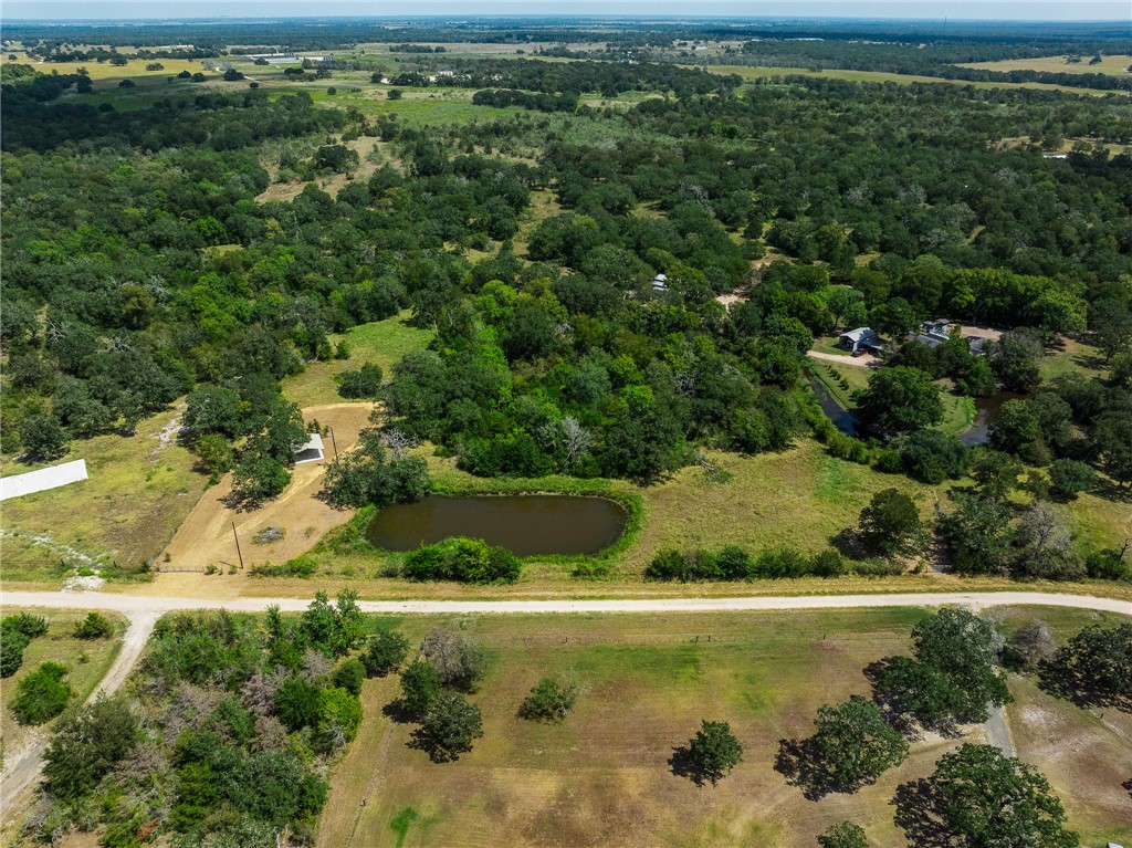 789 Quail Hollow Road Caldwell, TX 77836 - Photo 5 of 27 a view of a lake with a yard