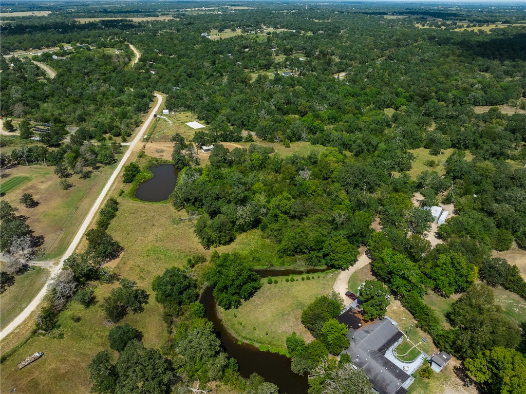 789 Quail Hollow Road Caldwell, TX 77836 - Photo 7 of 27 an aerial view of residential houses with outdoor space and trees