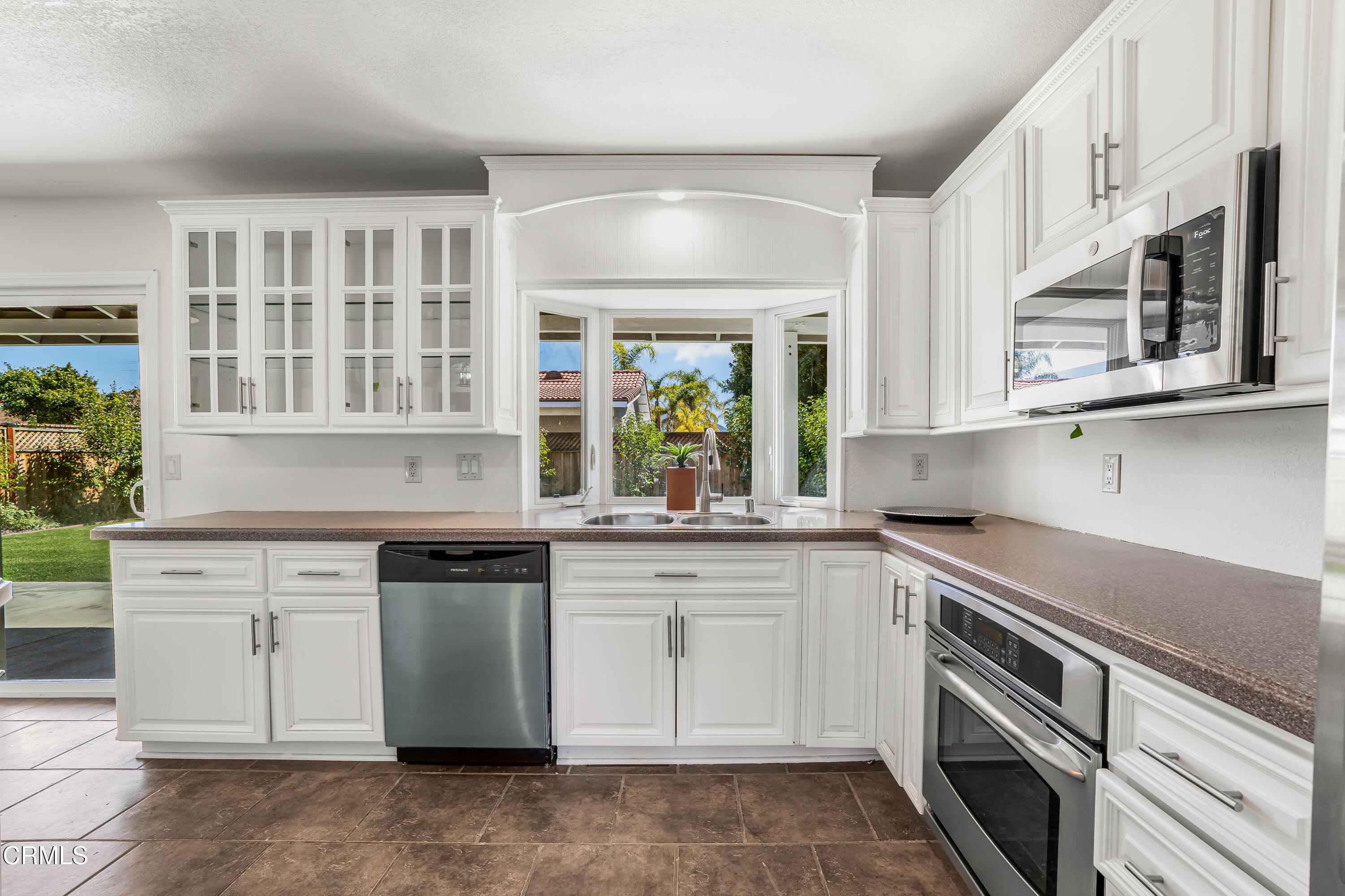 734 Balden Lane Fillmore, CA 93015 - Photo 13 of 46 a kitchen with stainless steel appliances granite countertop a stove and cabinets