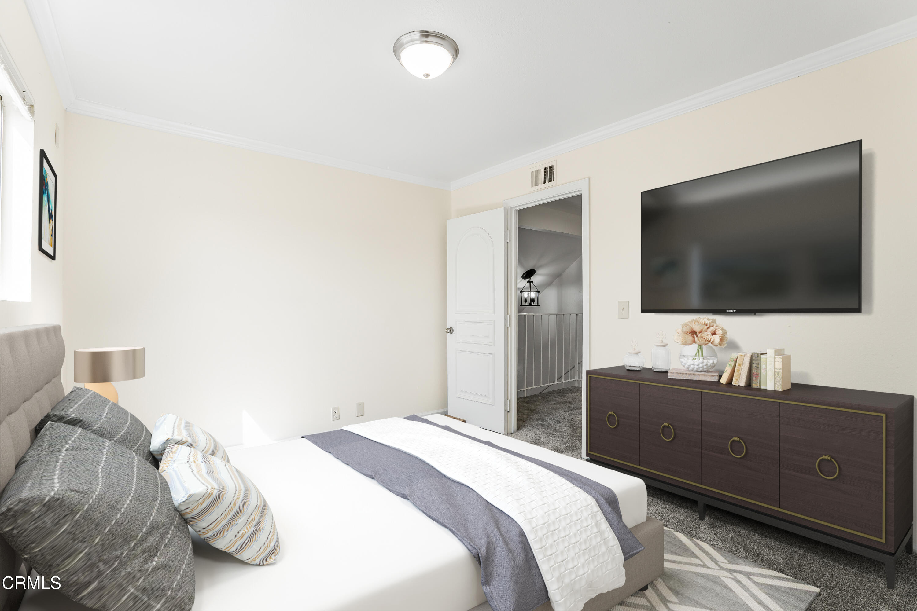 734 Balden Lane Fillmore, CA 93015 - Photo 19 of 46 a bedroom with a bed and a flat screen tv