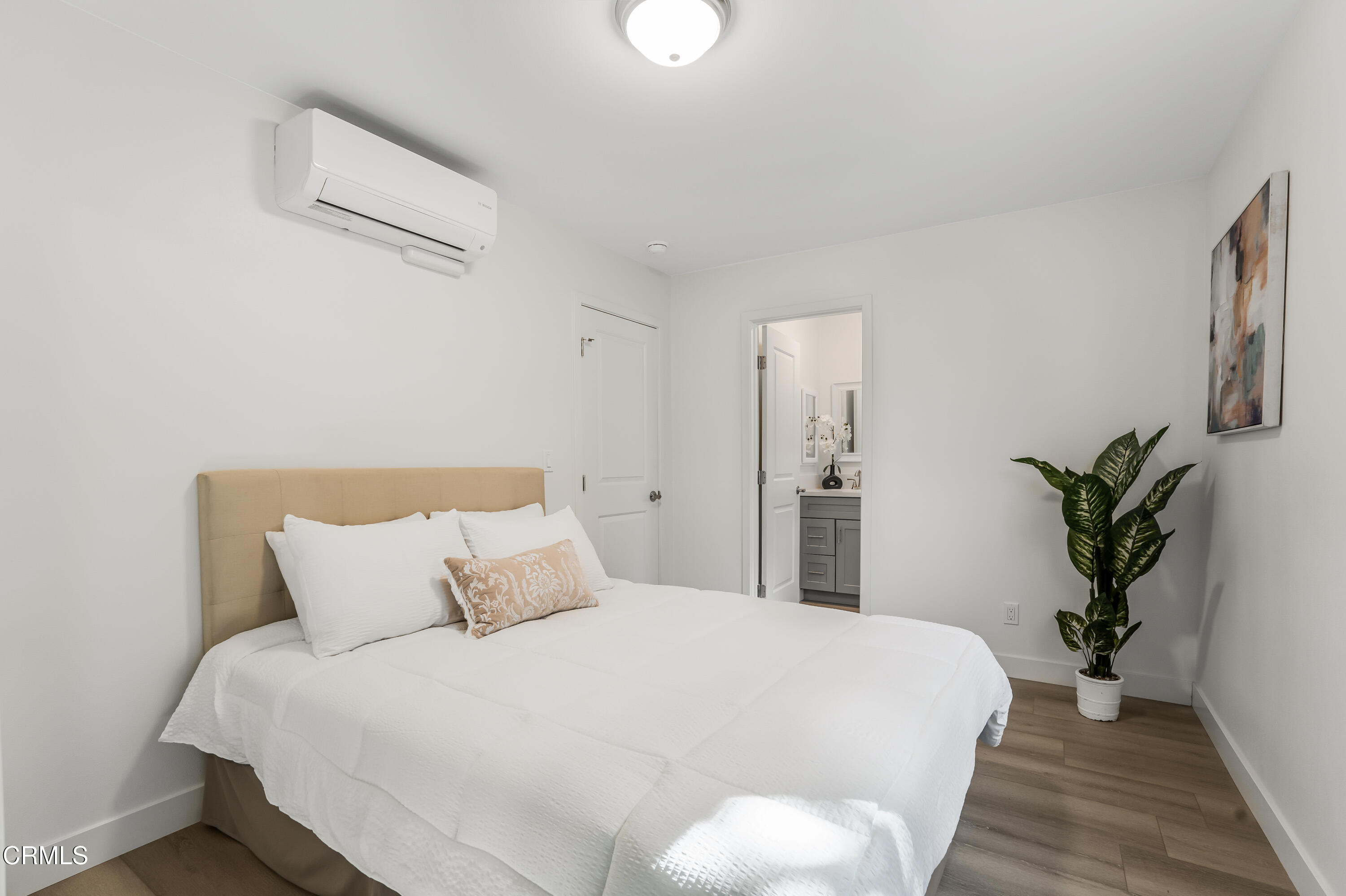 734 Balden Lane Fillmore, CA 93015 - Photo 32 of 46 a bedroom with a large bed and a potted plant