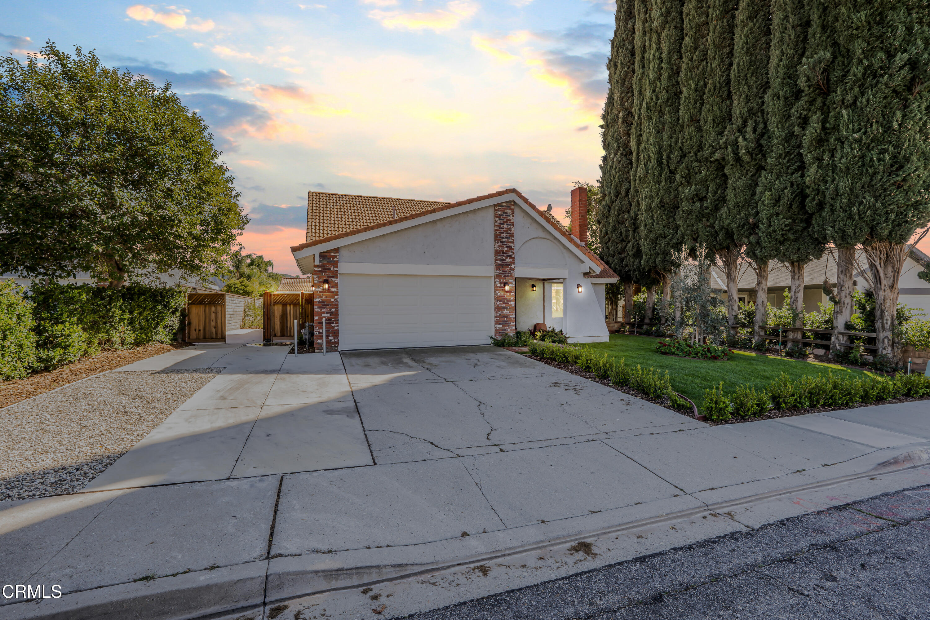 734 Balden Lane Fillmore, CA 93015 - Photo 41 of 46 a view of a white house with a yard and large tree