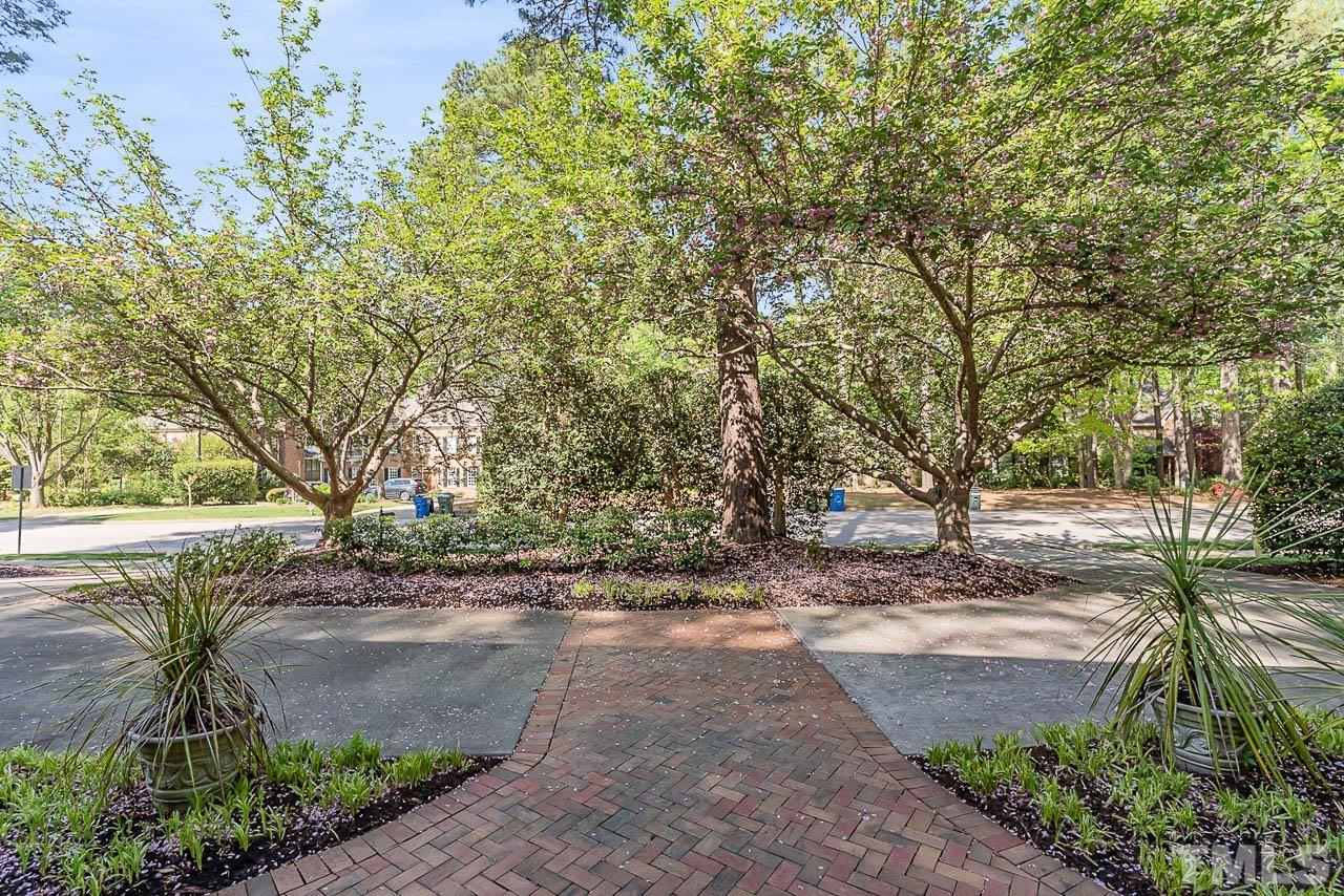 7512 Rainwater Road Raleigh, NC 27615 - Photo 11 of 45 a view of a yard with plants and trees