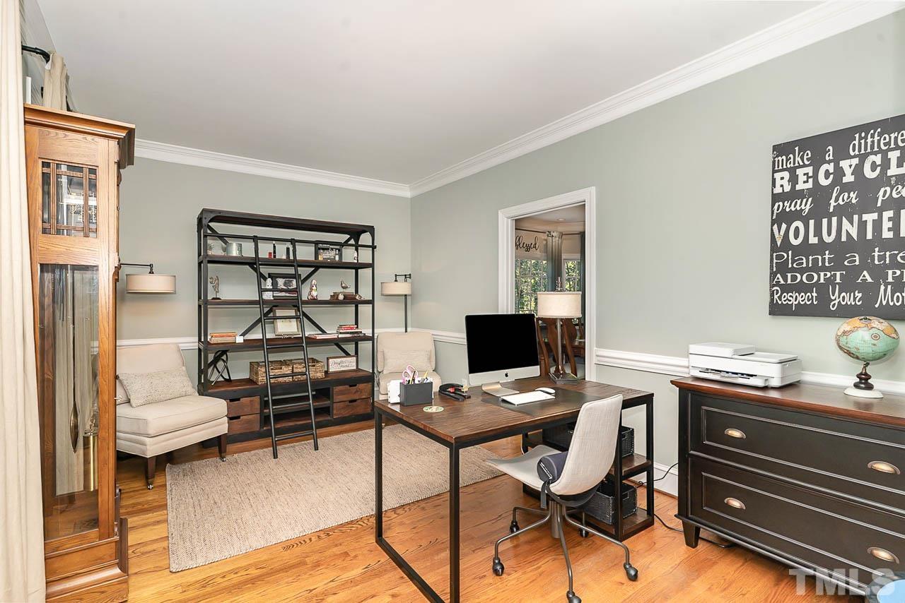 7512 Rainwater Road Raleigh, NC 27615 - Photo 14 of 45 a view of a workspace with furniture and a window