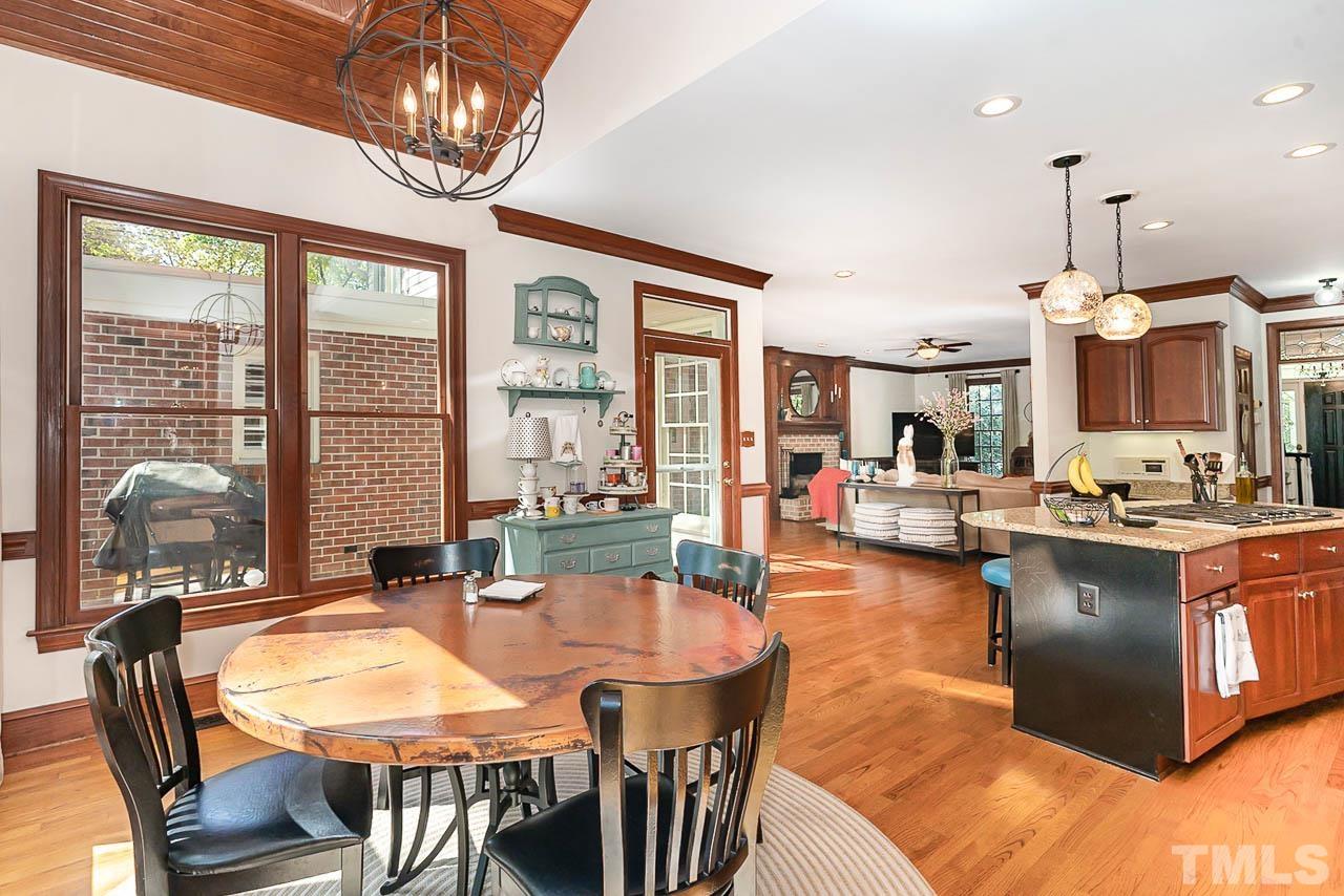 7512 Rainwater Road Raleigh, NC 27615 - Photo 27 of 45 a living room with dining table and a large window