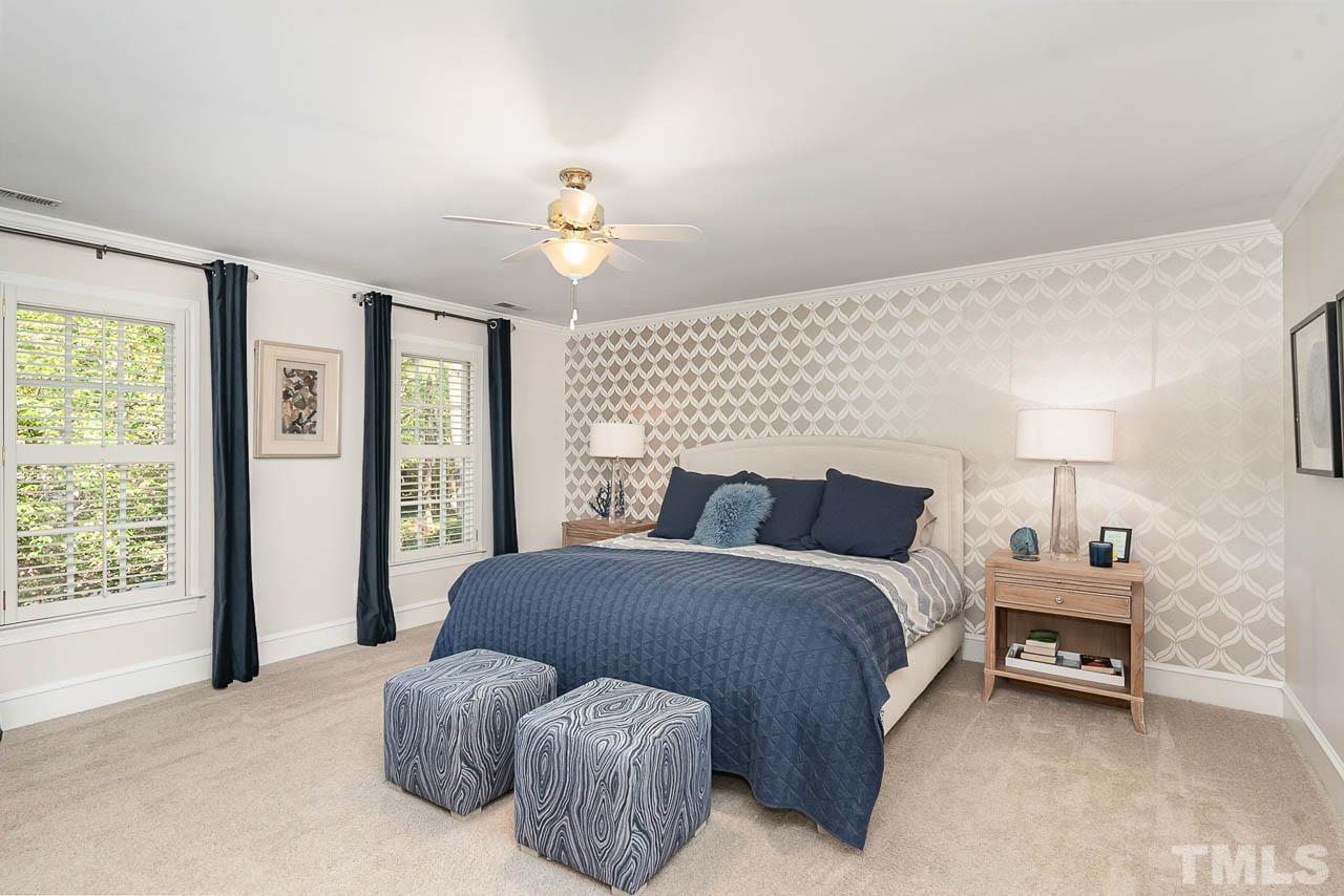 7512 Rainwater Road Raleigh, NC 27615 - Photo 32 of 45 a spacious bedroom with a bed and a large window