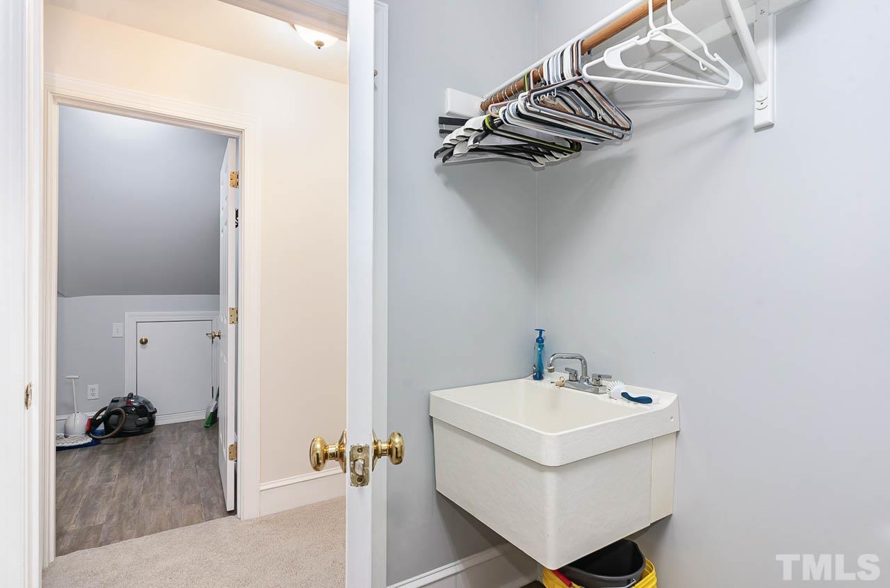 7512 Rainwater Road Raleigh, NC 27615 - Photo 41 of 45 a white sink sitting next to a bathroom