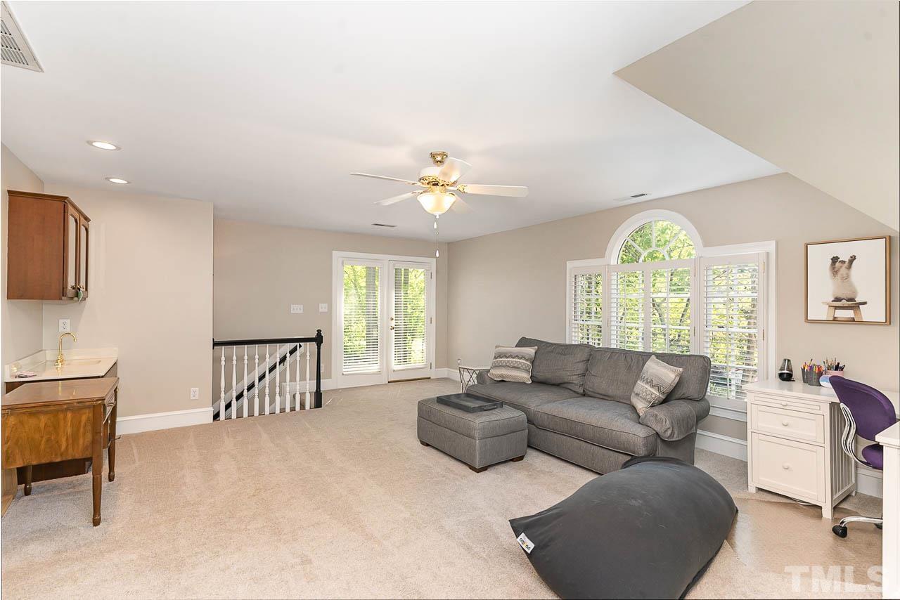 7512 Rainwater Road Raleigh, NC 27615 - Photo 43 of 45 a living room with furniture and a large window