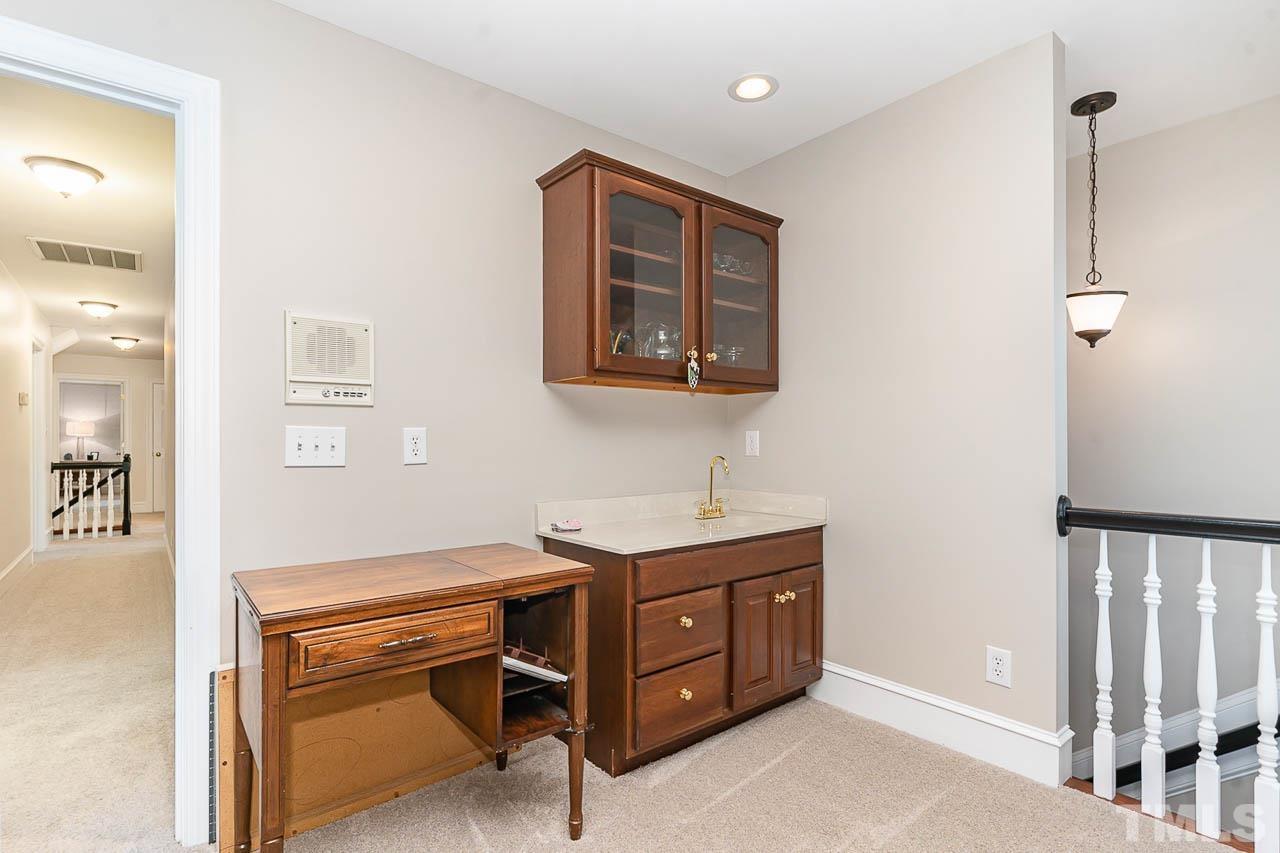 7512 Rainwater Road Raleigh, NC 27615 - Photo 44 of 45 a room with a table and chair
