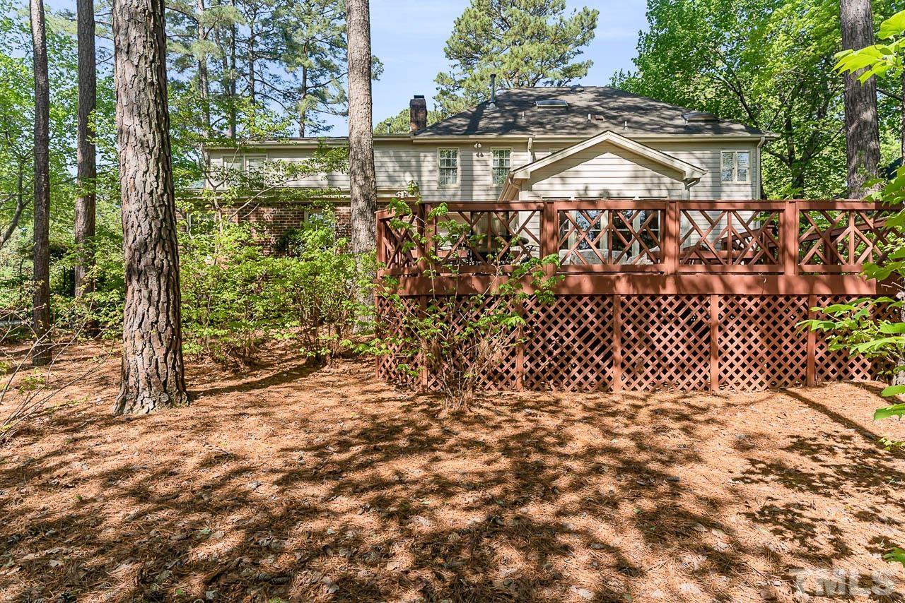 7512 Rainwater Road Raleigh, NC 27615 - Photo 9 of 45 a view of a pathway with a yard