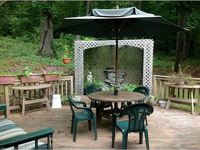 321 Boston Post Road East Lyme, CT 06333 - Photo 1 of 1 a view of an outdoor sitting area with furniture and wooden floor
